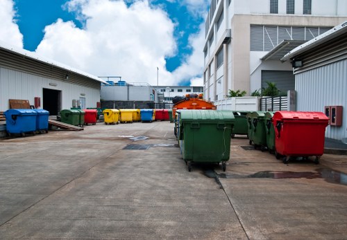 Commercial waste containers and recycling bins at collection site