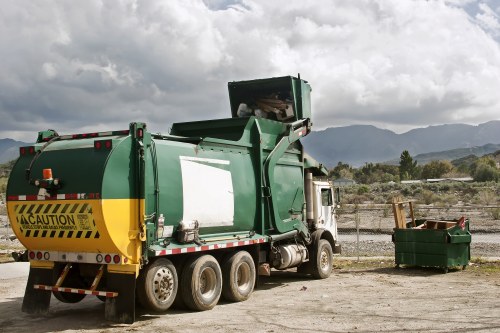 Modern waste removal truck in Uxbridge urban setting