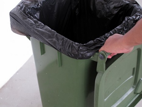 Recycling and waste management icon with Uxbridge skyline